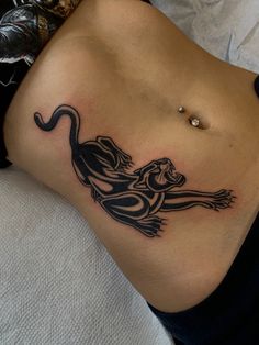 a woman with a tattoo on her stomach