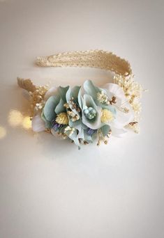 * It is made of mint green colored flowers and is decorated with natural dried flowers in between. * The crown is covered with shiny pearls. * Completely handmade. * Do not hesitate to contact us. * It consists of dried and artificial flowers. * All flower patterns are handmade to order and carefully worked with the same elements. Since every piece of flower is handmade, no two are exactly 100% identical and they can be arranged a little differently. This is what makes each beautiful piece special and unique. * Please note that colors may vary on different screens. Also, as we use natural dried flowers, the color tones may change from time to time. * As each pattern is handmade with dried flowers, it is expected that dried flowers will have fallen pieces in the shipping process due to thei Artificial Flower Crown, Bandana Embroidery, Green Flower Crown, Bohemian Flower Crown, Handmade Flower Crown, Mint Green Flowers, Flower Wreath Hair, Bohemian Flower, Crown For Women