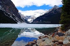 a lake surrounded by mountains and rocks