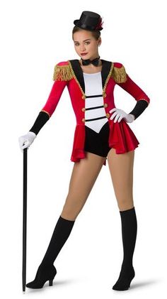 a woman in a red and black circus outfit holding a cane while posing for the camera