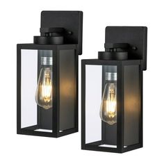 two black outdoor wall lights with one light on each side and the other off to the side