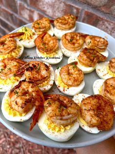 a plate with eggs and shrimp on it