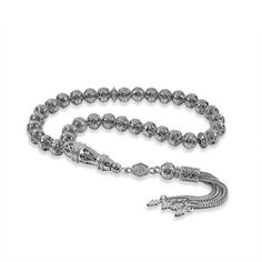 925 Sterling Silver Filigree Art Tasbih Unveil an unparalleled blend of spirituality and elegance with our intricately designed 925 Sterling Silver Filigree Art Tasbih. This iconic piece is more than just an accessory; it's a testament to masterful craftsmanship and profound devotion. Details and Craftsmanship: Each bead, accompanied by its gleaming silver chain, is carved from authentic 925 Sterling Silver, echoing an unparalleled attention to detail. The tasbih beads are carefully fashioned wi Spiritual Engraved Silver Rosary Bracelet, Silver Beaded Bracelets With 108 Round Beads, Silver Round Beads For Jewelry Making, Spiritual Silver 8mm Beads, Silver Jewelry With 108 Round Beads, Silver Rosary Bracelet With Polished Round Beads, Spiritual Silver Rosary Bracelet With Polished Beads, Bohemian Silver Rosary Bracelet With Round Beads, Traditional Rosary Bracelet With 8mm Beads