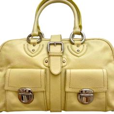 Marc Jacobs Venetia Bag Buttery Soft Calf Leather In Tapioca Yellow Alcantara Suede Lining Silver Tone Hardware Zip Top Buckle Closure Front Flap Compartments Inside Zip, Slip And Flap Pockets Measures Approximately 15" X 9" X 4" Includes Original Marc Jacobs Dust Bag Style No. C343001 100% Calf Leather Made In Italy Note: Very Tiny Scuff On Bottom And Some Hidden Marks Behind Silver Handle Rings Otherwise In Excellent Unused Condition. Please See Photos! Classic Yellow Shoulder Bag With Detachable Handle, Formal Yellow Bag With Double Handle, Formal Yellow Shoulder Bag With Double Handle, Formal Yellow Double Handle Bag, Formal Yellow Double Handle Bags, Classic Yellow Satchel With Detachable Handle, Classic Yellow Satchel With Top Carry Handle, Luxury Yellow Bag With Top Carry Handle, Classic Yellow Shoulder Bag With Top Carry Handle