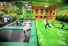 children are playing on an indoor trampoline course