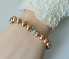 Bright Gold Pearl Silver One Strand Beaded Classic Wedding Bridal Bracelet. PLEASE READ ITEM DESCRIPTION and SHOP POLICIES before placing your order, and contact me with any questions! BRACELET is about 7.32 inches (18.6cm) long plus 1 inch extender chain. BRIDAL BRACELETS SECTION; https://www.etsy.com/shop/LanaChayka?ref=seller-platform-mcnav§ion_id=11638942 Elegant and timeless, this gorgeous bracelet is perfect for weddings or special occasions such as birthdays, anniversaries, graduations, proms...or whatever you can imagine! Handmade bracelet, is made with Bright Gold color premium quality European round crystal pearls, Sterling Silver end component, Rhodium Plated cz spacer bead, Rhodium Plated lobster clasp, and bead stringing wire. BRACELET will be shipped in a Free Gift Box. INTER Gold-plated Pearl Charm Bracelet For Wedding, Gold-tone Gold-plated Pearl Bracelet, Adjustable Gold-plated Pearl Bracelet For Weddings, Luxury Gold-plated Pearl Bracelet, Adjustable Yellow Gold-plated Pearl Bracelet, Gold Pearl Bracelet, Pearl Bracelet Gold, Pearl Bracelet Wedding, Pearl Bridal Jewelry