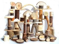 a group of wood pieces stacked on top of each other with different shapes and sizes