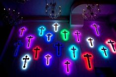 many crosses are lit up in the dark