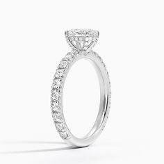 a diamond engagement ring on a white background