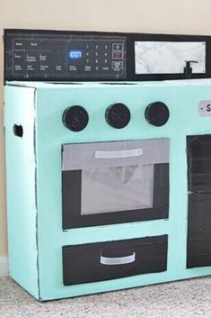 an old fashioned oven made out of cardboard