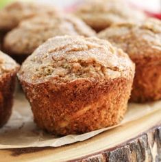 several muffins sitting on top of a wooden table