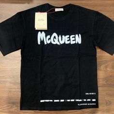 Greetings. I Am Selling A Brand New Alexander Mcqueen T Shirt. This Shirt Is In A Size Mens Xxl. Fits Slim Due To Eu Sizing. Fits More Like A Mens Usa Medium. Please, Serious Interests Only. Designer Letter Print Crew Neck Top, Designer Crew Neck Top With Letter Print, Designer Letter Print Tops For Streetwear, Designer Cotton T-shirt For Streetwear, Designer Black Crew Neck Shirt, Designer Crew Neck Top With Graphic Print, Designer Logo Print Tops For Streetwear, Designer Relaxed Fit Top With Letter Print, Designer Black Tops With Logo Print