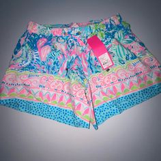 The Katia Short Is A 5 Inch Engineered Printed Pull On Short. These Shorts Have A Drawstring At The Waist And Slits On The Side Seam Openings. We Wear These Shorts From Morning To Night Time. 5" Inseam. Palm Beach Rayon (100% Rayon). Machine Wash Cold. Separately. Delicate Cycle. Garment Washed, Pull On Short With Drawstring On Waist And Slits On Side Seam Openings. Masterpiece Print. Cute Pajama Shorts For Beach Spring Season, Cute Spring Beach Pajama Shorts, Multicolor Beachy Shorts, Cute Pajama Shorts With Elastic Waistband For Beach, Cute Multicolor Shorts With Elastic Waistband, Cute Summer Vacation Pajama Shorts, Cute Green Beach Shorts, Pink High-waisted Pajama Shorts For Vacation, Cute Green Bottoms For The Beach