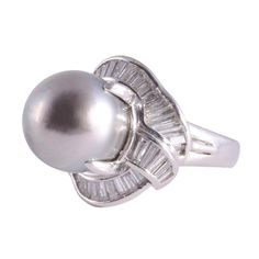 This is part of Chairish’s Fine Jewelry assortment.  Estate South Seas pearl platinum ring. This platinum ring features a 15-15.5mm South Seas pearl center that is a fine medium gray with a pinkish overtone. It is accented with 1.16 carat total weight of fine cut baguette diamonds having VS-SI clarity and G-H color. This South Seas pearl ring is a size 5.75, weighs 14.90 grams, and is appraised at $5,800. [ADTI 1012]  Metal: Platinum Stone: Diamond,South Sea Pearl Stone Cut: Baguette Cut Silver Platinum Pearl Ring Fine Jewelry, Luxury Silver Tahitian Pearl Ring, Silver Pearl Platinum Ring, Silver Platinum Pearl Ring, Classic Silver Tahitian Pearl Ring, Classic Silver Ring With Tahitian Pearl, Silver Tahitian Pearl Ring For Wedding, Elegant Gray Wedding Rings, Silver Tahitian Pearl Ring In Fine Jewelry Style