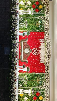 an aerial view of a lawn decorated with flowers