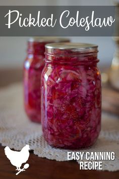 two jars filled with pickled coleslaw sitting on top of a table