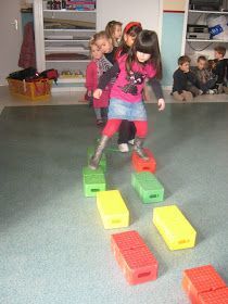 children playing with blocks on the floor