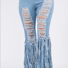 Features: I'll Crazy Distressed Light Denim Pants With Fringes On The Sides Giving You That Nice Curvy Fit Fabric & Care: 100% Polyester Wash In Cold Water Tumble Dry Or Hang Dry Spring Wide Leg Bottoms With Fringe, Trendy Denim Blue Bottoms With Fringe, Trendy High Waist Fringe Jeans, Trendy High Rise Bottoms With Fringe, Trendy Denim Bottoms With Fringe, Trendy Straight Leg Bottoms With Fringe, Spring High Rise Fringe Jeans, Spring Fringe Medium Wash Jeans, Denim Blue Fringed Bottoms For Spring