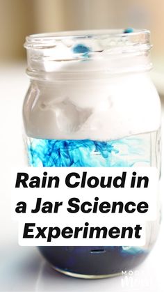 a jar filled with blue liquid sitting on top of a table