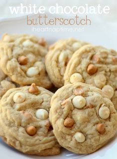 several cookies with white chocolate chips on a plate