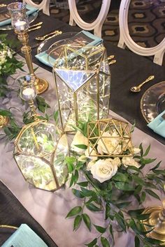 a table with candles, plates and flowers on it for an article about geometric candle holders $ 10 00 each to rent