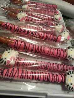 pink and black zebra print toothbrushes wrapped in plastic