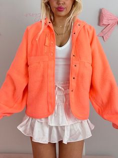 The Heartbreaker Tangerine Jacket from Sassy Shortcake features pockets, a front zipper, and snap button closure. Model is wearing a size small. Also available in other color options.