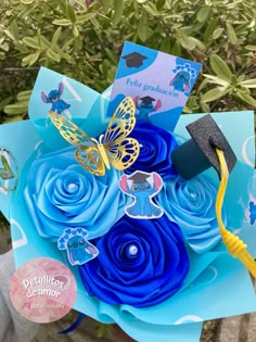 a graduation bouquet made out of blue paper