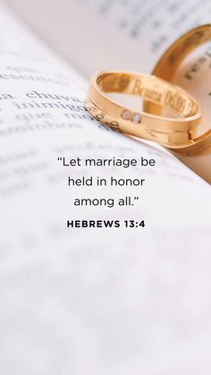 two wedding rings sitting on top of an open book with the words, let marriage be held in honor among all hebrews