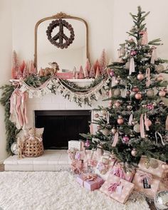 a decorated christmas tree in front of a fireplace