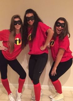 three women in matching costumes posing for the camera with their hands on their hipss