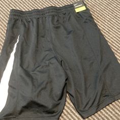 New With Tag Nike Shorts Casual Black Bottoms For Sports Season, Casual Black Athletic Shorts For Sports Events, Casual Moisture-wicking Bottoms For Sports, Casual Moisture-wicking Bottoms For Sports Events, Moisture-wicking Black Bottoms For Sports, Black Sporty Bottoms For Sports Events, Black Moisture-wicking Bottoms For Sports Season, Nike Black Athletic Shorts With Elastic Waistband, Black Go-dry Bottoms For Sports Events