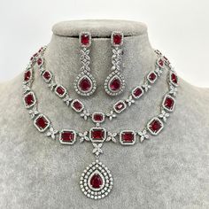 Ruby CZ diamond necklace, American Diamond wedding necklace, Cz jewelry, Indian, Pakistani, Punjabi wedding jewelry, Bridal necklace' Regular Size And Adjustable with rhodium finish Ships from California, USA Delivery in 2-5 business days in the USA. Other colors can be found here https://www.etsy.com/listing/1423097794/sapphire-cz-diamond-bridal-necklace?ref=listings_manager_grid https://www.etsy.com/listing/1423095388/emerald-cz-diamond-bridal-necklace?ref=listings_manager_grid Color, shades, and texture displayed may slightly vary from the actual product due to digital image limitations. We request you consider these minor variations. Please expect the possibility of some slight imperfections when buying handmade jewelry. Please let me know if you have any questions. Arrives in a gift b Wedding Diamond Necklace With Jewels In Cubic Zirconia, Wedding Diamond Necklace With Jewels, Wedding Diamond Necklace With Cubic Zirconia, Wedding Cubic Zirconia Diamond Necklace, Diamond Jeweled Bridal Necklace For Wedding, Diamond Bridal Necklace For Wedding, Wedding Diamond Bridal Necklace With Jewels, Wedding Bridal Necklace With Diamonds, Wedding Bridal Diamond Necklace