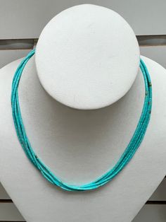 Vibrant, Southwestern, and versatile beaded Turquoise Heishi necklace. This necklace is lightweight and comfortable, making it ideal for everyday wear. It adds a pop of color and a Southwestern vibe to your outfit. You can pair this simple Turquoise necklace with anything.  All findings are 925 sterling silver. Measurements: 2x3mm turquoise tube beads. The necklace is a 5 strand beaded necklace with a lobster claw clasp.   Handcrafted in the USA. The necklace will be packed securely in a gift box.  Thanks for looking! Southwestern Multi-strand Turquoise Gemstone Necklace, Southwestern Multi-strand Turquoise Beaded Necklace, Southwestern Single Strand Turquoise Necklace, Southwestern Turquoise Necklace With Tiny Beads, Southwestern Blue Necklace With Tiny Beads, Collier Heishi, Heishi Necklace, Tube Beads, Sterling Silver Necklace