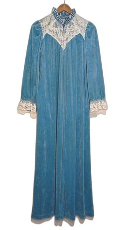 Pretty medium blue velour robe from late 70's / early 80s in excellent pre-owned condition. Size S. Robe has hidden side seam pockets and a full zippered front. Sleeves have a nice pouf at the shoulder. Lots of lace detail at the bodice. Bust:17 in across the back Length: 55 in Hip:free Shoulder to Shoulder:13 1/4 in Vintage Robes, Womens Pajamas, Dress Inspo, 70s Dress, Pajama Robe, Pajamas Women, Swing Dress, Medium Blue, Vintage 70s