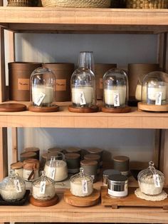 the shelves are filled with jars and containers