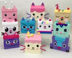 several different colored boxes with cats on them