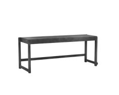 a black bench sitting on top of a white wall next to a metal frame table