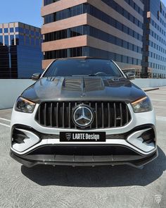 the front end of a mercedes benz amg coupe