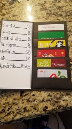 an open book on a counter top with some cards attached to the front and back