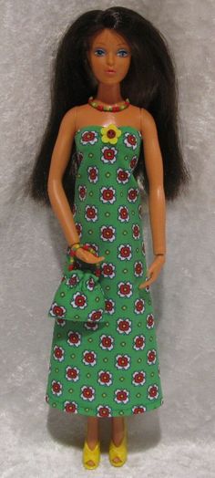 a doll wearing a green dress and yellow shoes