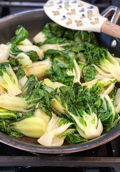 some vegetables are cooking in a pan on the stove