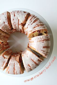 a white plate topped with a cake covered in frosting