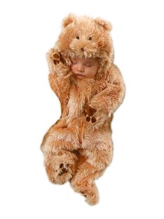 a baby dressed in a teddy bear costume