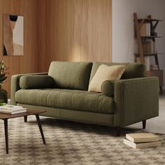 a living room scene with focus on the couch and coffee table in the foreground