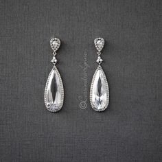 Large Elongated Water Drop CZ Earrings Elegant Crystal Teardrop Earrings With Rhinestones, Elegant Teardrop Crystal Embellished Earrings, Formal Rhinestone Teardrop Earrings, White Diamond-accented Teardrop Earrings For Wedding, White Diamond Accent Teardrop Earrings For Wedding, Formal Teardrop Diamond Accent Earrings, White Diamond Accents Teardrop Earrings For Wedding, Silver Crystal Long Drop Teardrop Earrings, Teardrop Diamond Bridal Earrings With Sparkling Stones