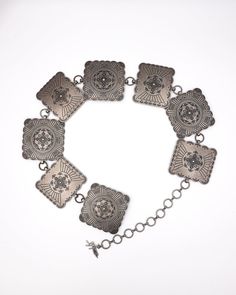 Angel Ranch Ladies belt by M&F Western Products. Chain style belt with a floral engraved design on 3” square conchos. Silver. Conchos Measure: 3”. Floral Design. Size Chart: M = 42” L = 51” XL = 53” Square Concho Belt, Ladies Belt, Concho Belt, Engraved Design, M F, Chain Belt, Belts For Women, Chain Styles, Floral Design