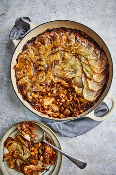 a casserole dish filled with baked beans and sliced banana's on a plate