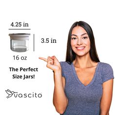 a woman is pointing to the top of a glass jar with measurements for it and how much space she has in her hand