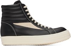 High-top grained calfskin sneakers in black. · Lace-up closure · Quilted padded collar · Calfskin suede appliqué at sides · Calfskin lining · Treaded thermoplastic rubber sole · Contrast stitching in off-white Supplier color: Black/Milk/Milk Black Sneakers With Vulcanized Sole In Calf Leather, Black Calf Leather Sneakers With Vulcanized Sole, Calf Leather Sneakers With Stitched Sole For Streetwear, Calf Leather High-top Sneakers With Textured Sole For Streetwear, Black Calf Leather High-top Sneakers For Streetwear, High-top Sneakers With Leather Sole For Sports, Sporty Black High-top Sneakers With Stitched Sole, Rick Owens Sneakers, Vintage Sneakers